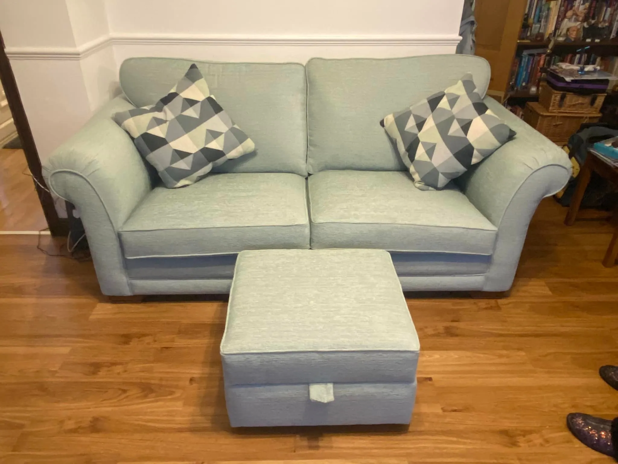 A recently re-upholstered couch alongside an ottoman Rotherham